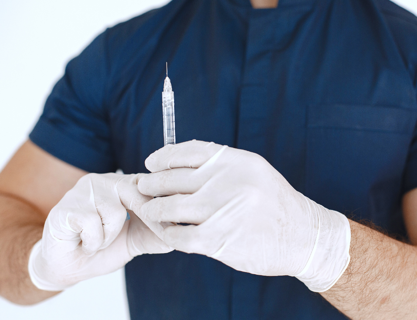 Doctor holding a syringe