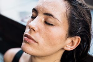 Woman suffering from excessive sweating